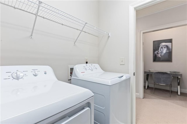 clothes washing area with carpet floors and washing machine and dryer