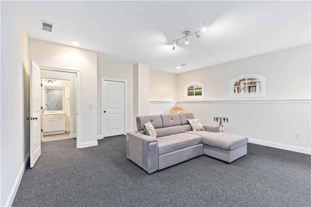 living room featuring dark colored carpet