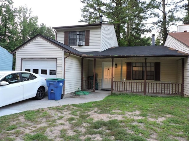 view of front of house with a porch, cooling unit, driveway, and a garage