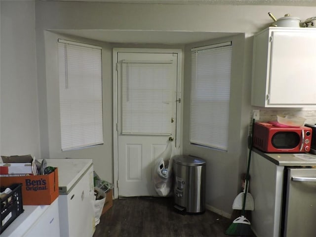 laundry room with dark wood-type flooring