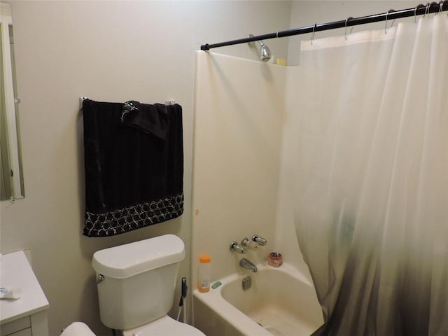 full bathroom featuring toilet, shower / bath combination with curtain, and vanity