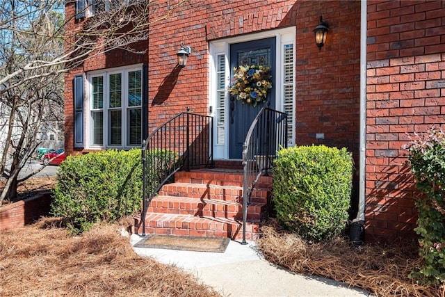 entrance to property with brick siding