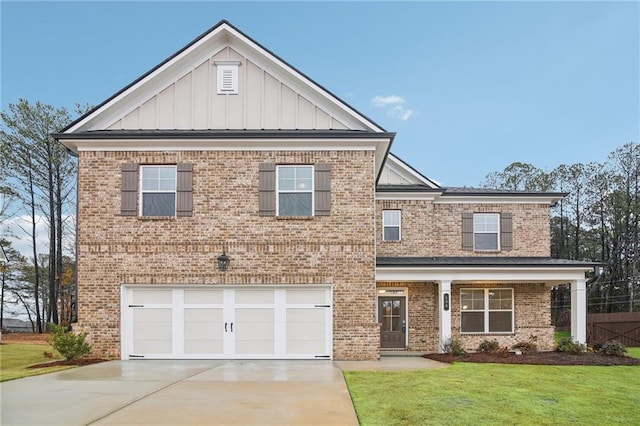 view of front of home with a garage and a front lawn