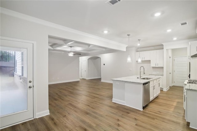 kitchen with white cabinetry, a center island with sink, dishwasher, and light hardwood / wood-style flooring