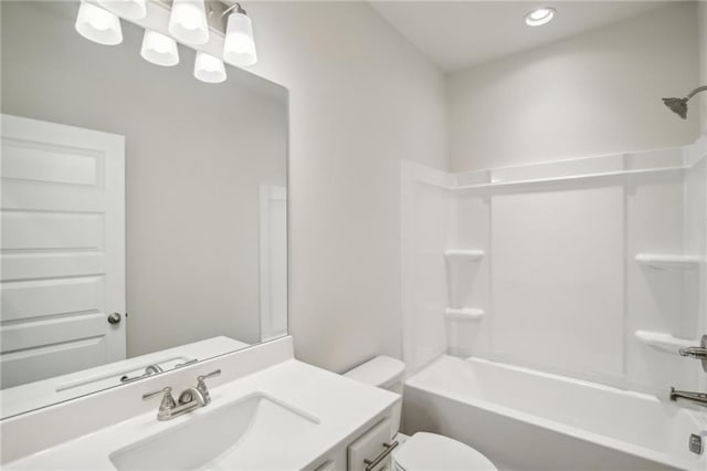 full bathroom with vanity, bathtub / shower combination, and toilet