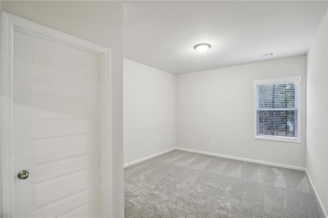 empty room with light colored carpet