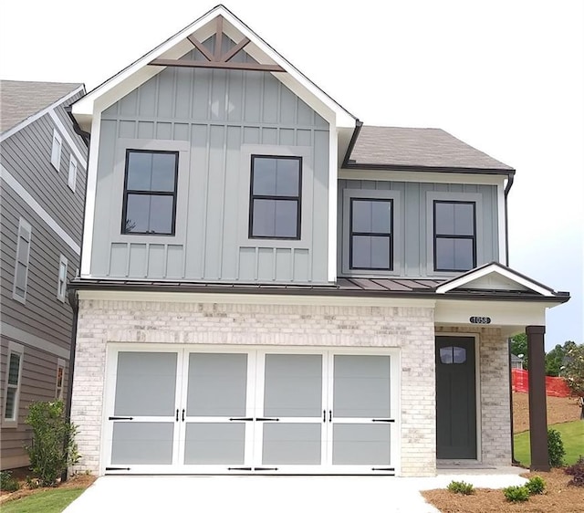 1058 Crest Mill Dr, Marietta, GA 30008 - view of front of property with board and batten siding, a garage, driveway, and roof with shingles