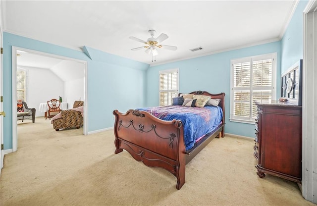 bedroom featuring ceiling fan, crown molding, light carpet, and vaulted ceiling