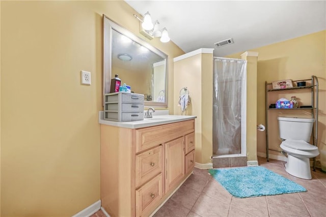 bathroom featuring toilet, vanity, tile patterned floors, and curtained shower