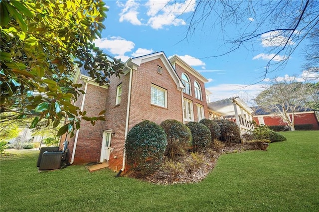 view of property exterior featuring a lawn, cooling unit, and a pergola