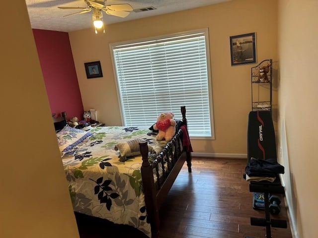 2256 Hansford Pass, Buford, GA 30519 - bedroom with hardwood / wood-style flooring, baseboards, and a ceiling fan