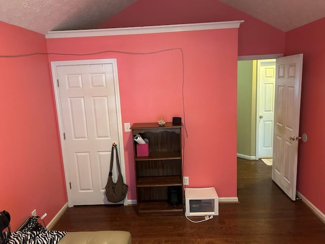 2256 Hansford Pass, Buford, GA 30519 - bedroom with vaulted ceiling, wood finished floors, and baseboards