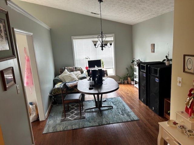 2256 Hansford Pass, Buford, GA 30519 - living area featuring vaulted ceiling, a textured ceiling, dark wood-type flooring, and a chandelier