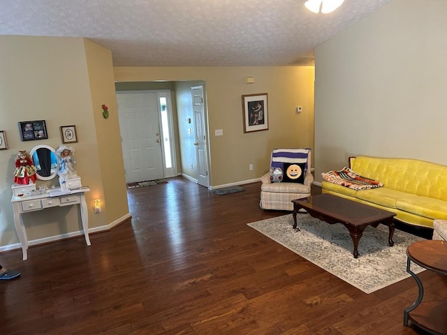 2256 Hansford Pass, Buford, GA 30519 - living area featuring a textured ceiling, baseboards, and wood finished floors