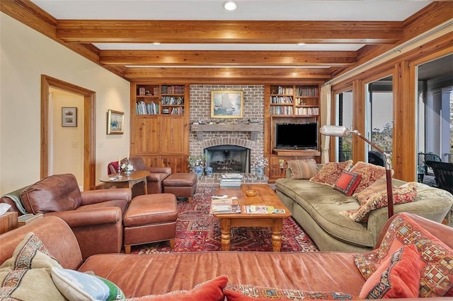 living room with a fireplace, built in features, and beamed ceiling