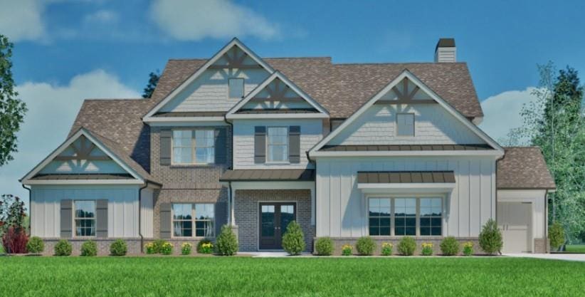 2316 Pebble Trl, Monroe, GA 30656 - craftsman-style home with a standing seam roof, a chimney, board and batten siding, and a front lawn
