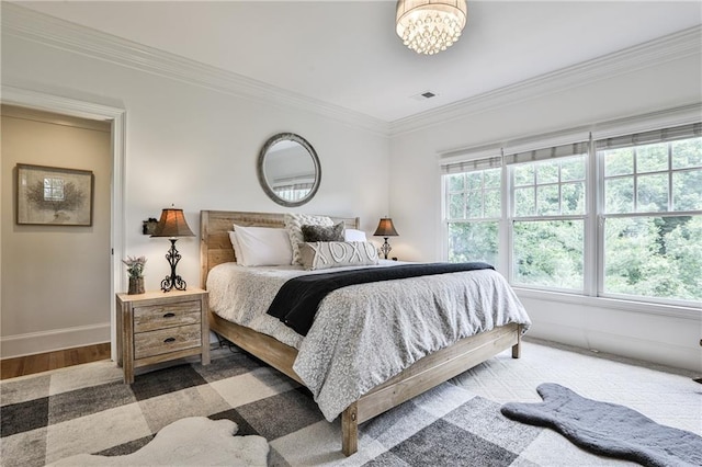 bedroom with crown molding, dark wood-type flooring, and an inviting chandelier