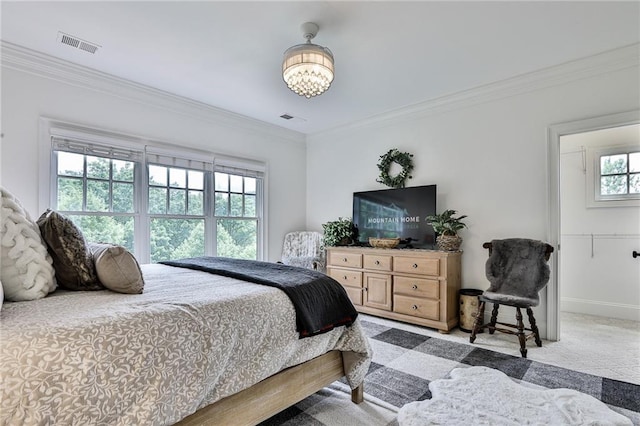 carpeted bedroom with ornamental molding