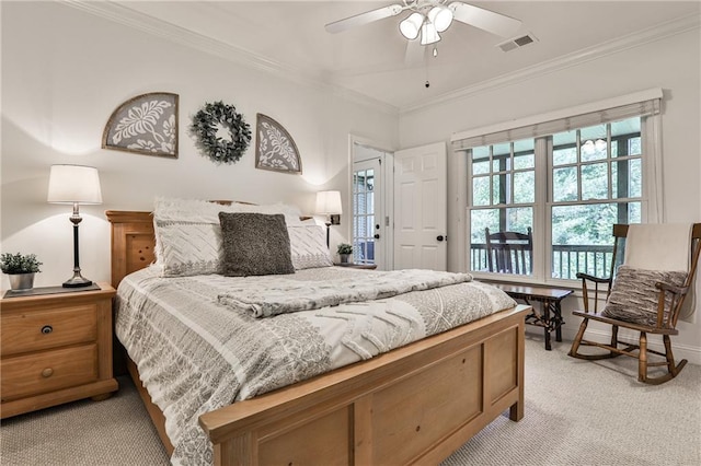 carpeted bedroom with ceiling fan and crown molding