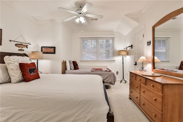 carpeted bedroom with crown molding, ceiling fan, and lofted ceiling