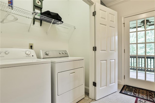 laundry room featuring washer and clothes dryer, ceiling fan, and crown molding