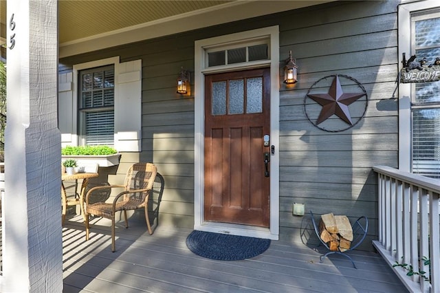 view of exterior entry featuring a porch