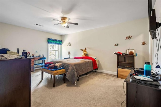 bedroom featuring ceiling fan and light carpet