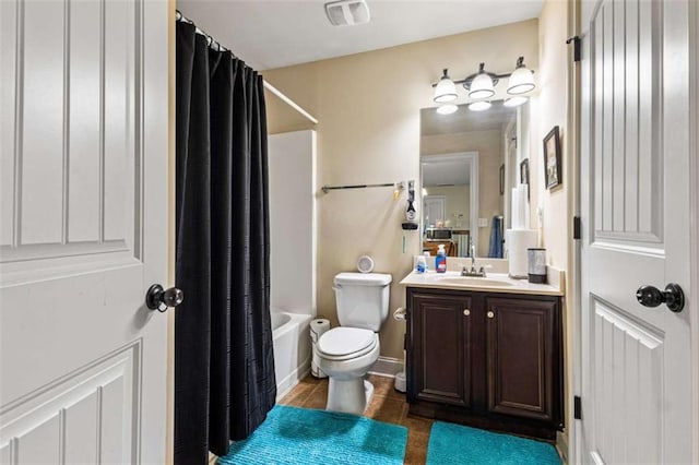 full bathroom with vanity, shower / bathtub combination with curtain, tile patterned floors, and toilet