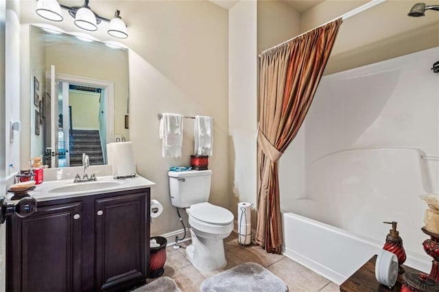 full bathroom with shower / bathtub combination with curtain, vanity, tile patterned floors, and toilet