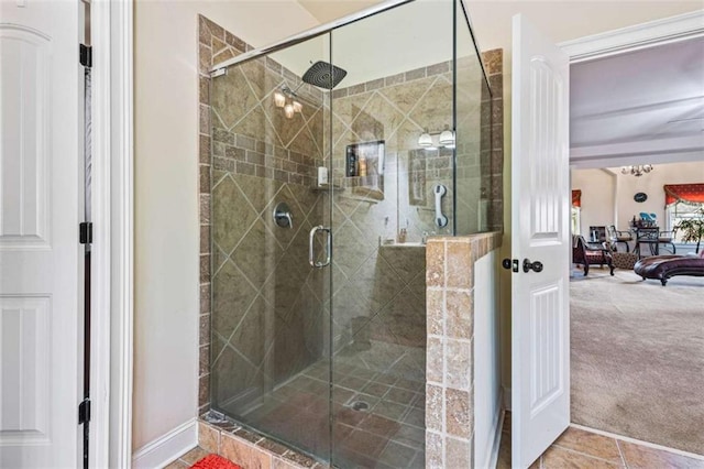 bathroom featuring a shower with shower door and tile patterned flooring