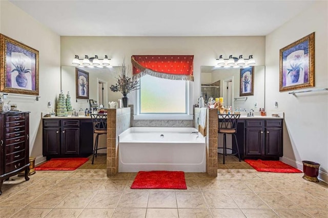 bathroom featuring tile patterned floors, shower with separate bathtub, and vanity