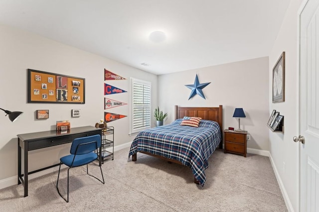 bedroom featuring carpet floors, baseboards, and an office area