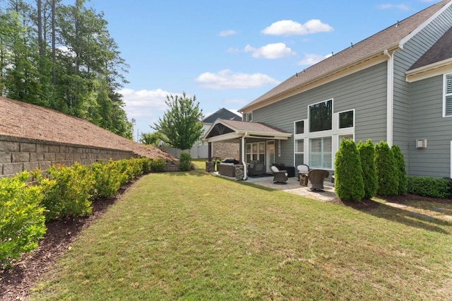 rear view of house with a patio and outdoor lounge area