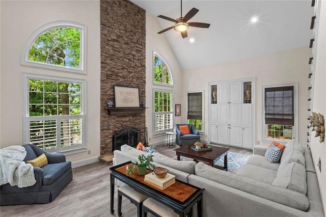 121 Clipper Bay Dr, Alpharetta, GA 30005 - living area featuring high vaulted ceiling, a ceiling fan, light wood-type flooring, a fireplace, and recessed lighting