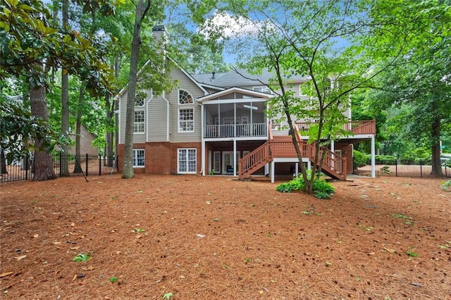 121 Clipper Bay Dr, Alpharetta, GA 30005 - rear view of house featuring a sunroom, stairway, a chimney, and a deck