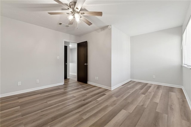 unfurnished room featuring ceiling fan and light wood-type flooring