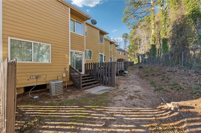 rear view of property with central air condition unit