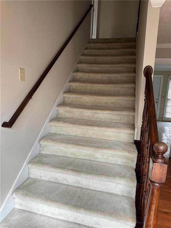 stairway with crown molding