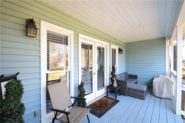 deck with french doors and a grill