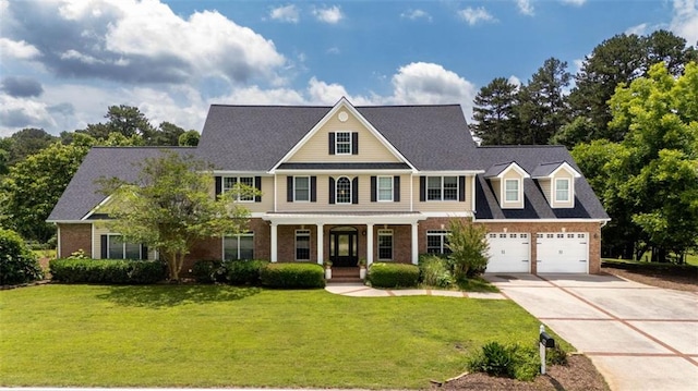 4337 Mountain View Rd, Oakwood, GA 30566 - view of front of home featuring a porch, brick siding, concrete driveway, a front yard, and a garage
