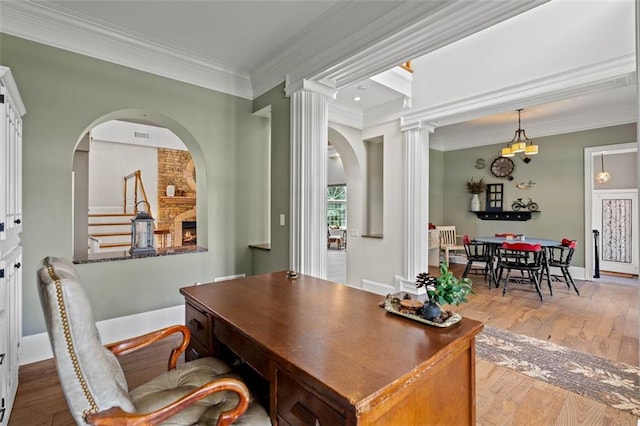 4337 Mountain View Rd, Oakwood, GA 30566 - home office featuring crown molding, wood finished floors, decorative columns, and arched walkways