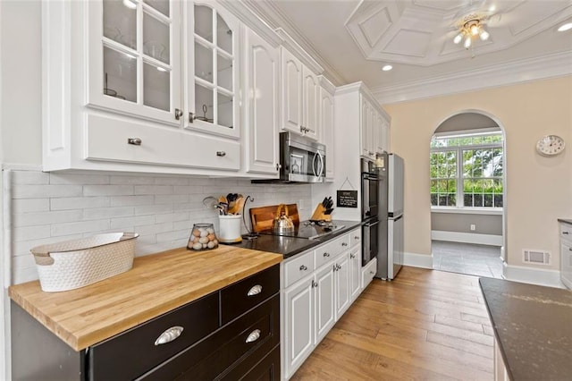 4337 Mountain View Rd, Oakwood, GA 30566 - kitchen with black appliances, white cabinets, glass insert cabinets, arched walkways, and crown molding