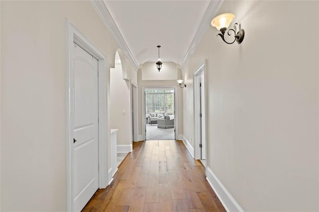 4337 Mountain View Rd, Oakwood, GA 30566 - hall featuring arched walkways, ornamental molding, and hardwood / wood-style floors
