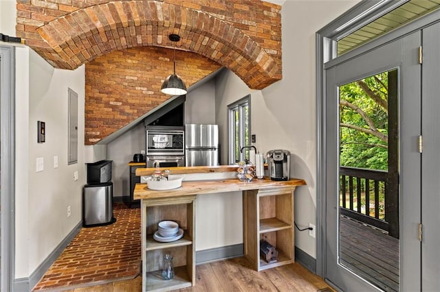 4337 Mountain View Rd, Oakwood, GA 30566 - kitchen with appliances with stainless steel finishes, vaulted ceiling, open shelves, brick ceiling, and electric panel