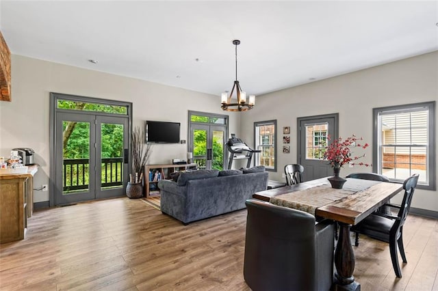 4337 Mountain View Rd, Oakwood, GA 30566 - dining room with a chandelier and light wood-type flooring
