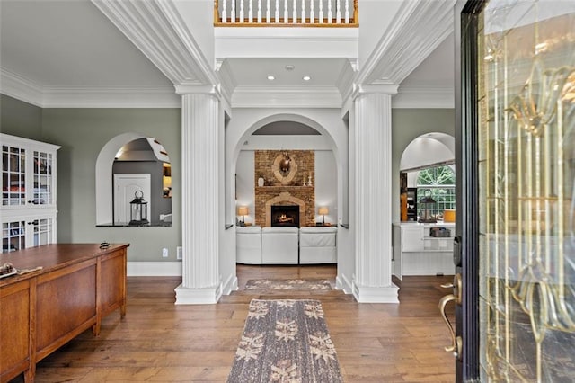 4337 Mountain View Rd, Oakwood, GA 30566 - foyer entrance with ornate columns, crown molding, hardwood / wood-style flooring, and a fireplace