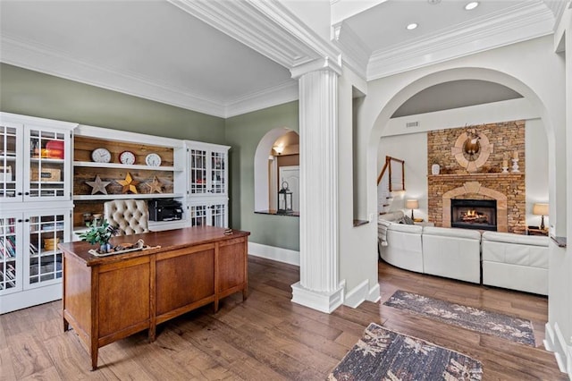 4337 Mountain View Rd, Oakwood, GA 30566 - office with crown molding, arched walkways, ornate columns, wood finished floors, and a fireplace