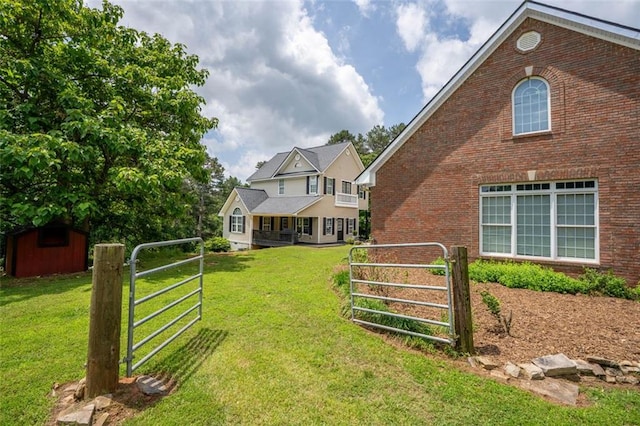 4337 Mountain View Rd, Oakwood, GA 30566 - view of yard with a gate and a storage unit