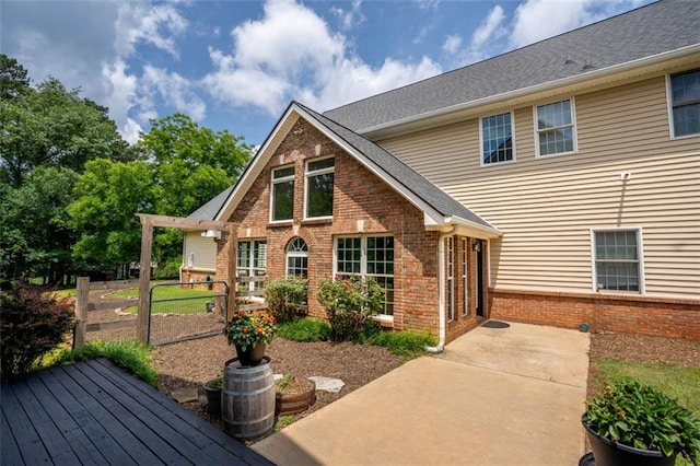 4337 Mountain View Rd, Oakwood, GA 30566 - view of front facade featuring brick siding and a patio