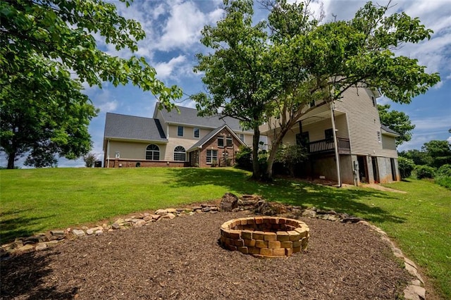 4337 Mountain View Rd, Oakwood, GA 30566 - back of house featuring a fire pit and a yard